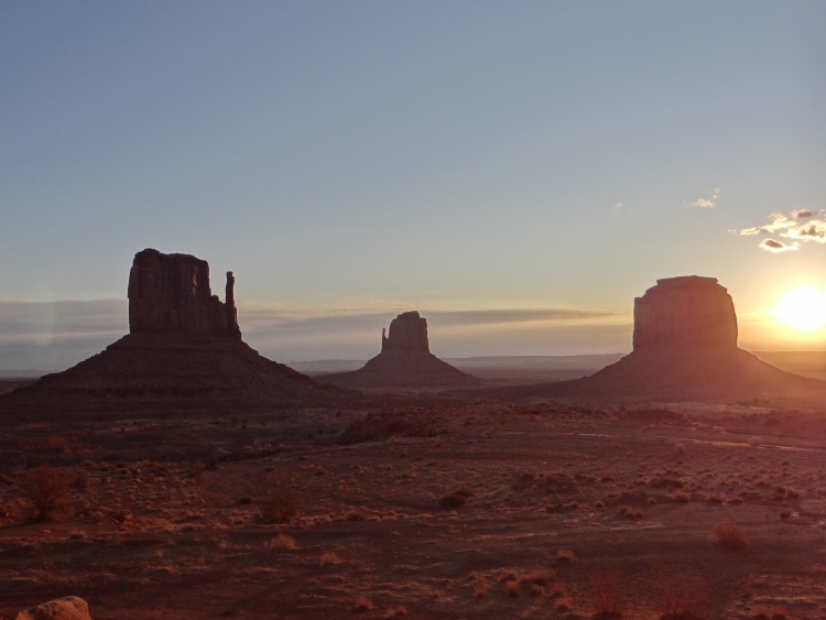 Monument Valley - Mittens and Merrick Buttes at sunrise.